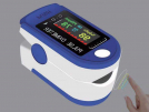 Fingertip pulse oximeter with LED screen.
